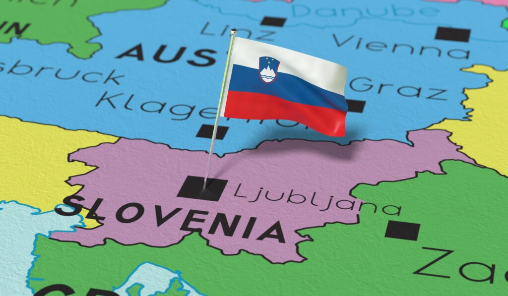 A 3D political map featuring the Slovenian flag pinned directly on Ljubljana.